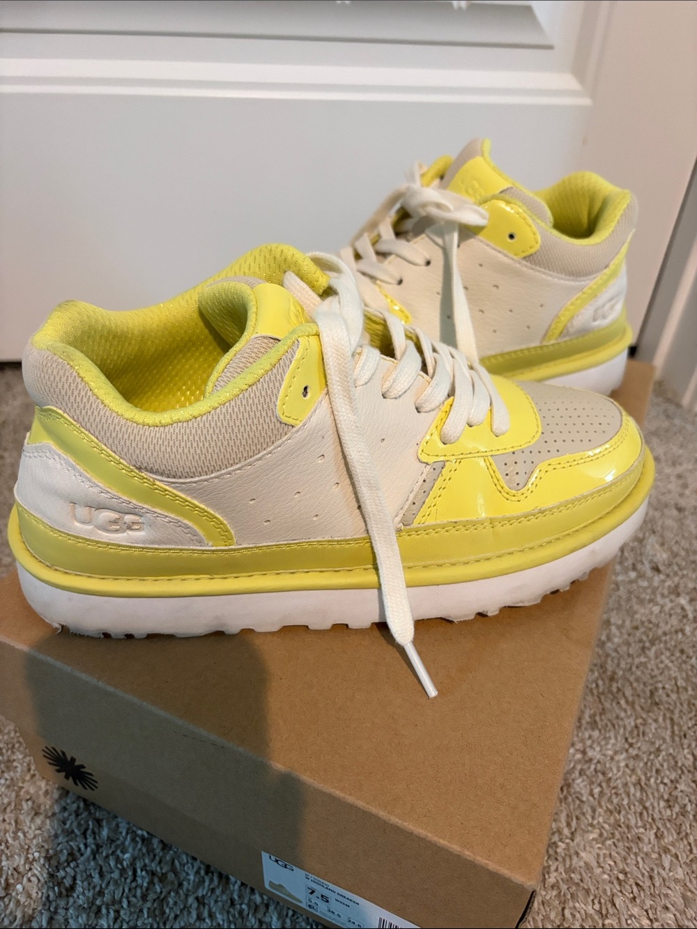 UGG women’s Yellow and White Low-Top Sneakers with Gloss Accents